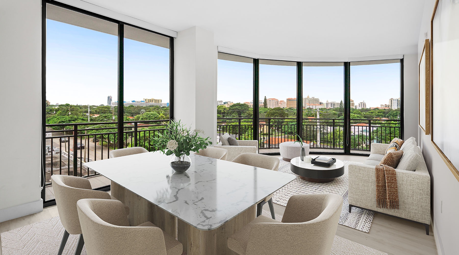 Spacious Living Rooms large living room with a table chairs couch and many windows