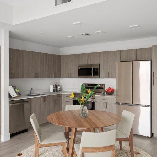 Generous living spaces to relax and unwind a kitchen with a dining table and chairs