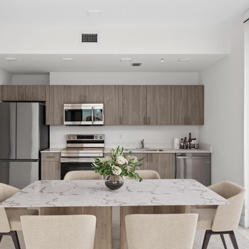 Kitchens With Everything You Need a kitchen with a dining table and chairs